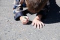Kid drawing on asphalt in spring, child paint crayons