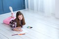 Kid drawing hobby childhood girl floor picture Royalty Free Stock Photo