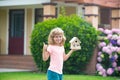 Kid dreaming of new home. Happy boy holding dream house in their hands, real estate and home insurance concept. Mortgage Royalty Free Stock Photo