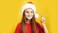 Kid dressed in red Santa Claus hat, Portrait of little girl smile. Concept of holiday Christmas Xmas day or Happy new year, studio Royalty Free Stock Photo