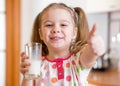 Kid drinking milk from glass Royalty Free Stock Photo