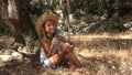 Kid Drinking Water in Olive Orchard, Farmer Child Playing Relaxing Outdoor in Nature, Teenager Girl Drinks Water in Park Royalty Free Stock Photo