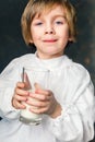 Kid drinks a glass of milk Royalty Free Stock Photo