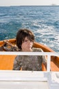 Kid Driving a Boat Royalty Free Stock Photo