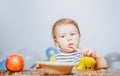 Kid eat healthy nutrition, baby food. Babies eating with spoon. Funny kid boy with plate and spoon. Royalty Free Stock Photo