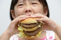 Kid eating big burger Royalty Free Stock Photo