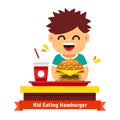 Kid eating and drinking at fast food table