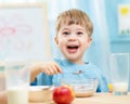 Kid eating healthy food at home Royalty Free Stock Photo