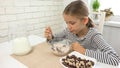 Kid Eating Milk and Cereals at Breakfast, Child in Kitchen, Teenager Girl Tasting Meal Royalty Free Stock Photo