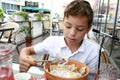 Kid eating vareniki