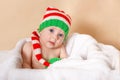 Kid enjoy the holiday. Happy toddler. Funny baby is wearing an elf Royalty Free Stock Photo