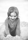 Kid enjoying time at the sand beach. Child making sandcastle on sea. Royalty Free Stock Photo