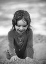 Kid enjoying time at the sand beach. Child making sandcastle on sea. Royalty Free Stock Photo