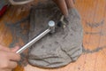 Kid excavating animal bones from rock