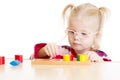 Kid in eyeglases playing logical game isolated