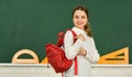 Kid fashion. Back to school. happy girl carry backpack at blackboard. math lesson classroom. smart hipster teen child