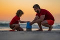 Kid and father building sandcastle. Father and son playing on the beach. Friendly family. Father and son playing in the