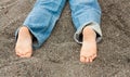 Kid feet in sand Royalty Free Stock Photo