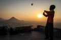 Kid flying his kite at sunset at the Pap Mochani Gayatri Temple, Pushkar, Rajasthan, India Royalty Free Stock Photo