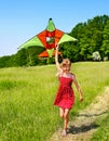 Kid flying kite outdoor. Royalty Free Stock Photo