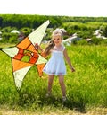 Kid flying kite outdoor. Royalty Free Stock Photo