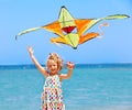 Kid flying kite outdoor. Royalty Free Stock Photo
