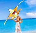 Kid flying kite outdoor. Royalty Free Stock Photo