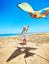 Kid flying kite outdoor. Royalty Free Stock Photo