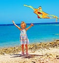 Kid flying kite outdoor. Royalty Free Stock Photo