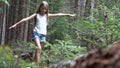 Kid in Forest Walking Tree Log, Child Playing in Park, Teenager Girl in Camping Adventure, Children in Forest Mountains Royalty Free Stock Photo