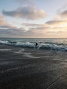 Kid getting slammed by wave on beach Royalty Free Stock Photo
