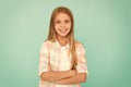 Kid girl blonde hair posing confidently. Girl feels confident with crossed arms. Child hold hands confidently crossed