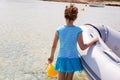 Kid girl in boat at formentera Estany des Peix