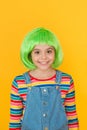 Kid girl with bright vibrant hairstyle. Artificial wig concept. Pigment dye hair. Freedom for expression. Fantasy hair Royalty Free Stock Photo