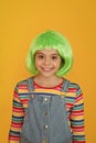 Kid girl with bright vibrant hairstyle. Artificial wig concept. Pigment dye hair. Freedom for expression. Fantasy hair Royalty Free Stock Photo