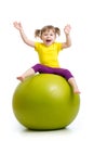 Kid girl doing gymnastics with ball isolated on white background Royalty Free Stock Photo