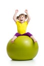 Kid girl doing gymnastics with ball over white background Royalty Free Stock Photo