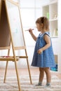 Kid girl drawing on white board Royalty Free Stock Photo