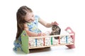 Kid girl feeding and playing kitten cat Royalty Free Stock Photo