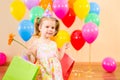 Kid girl with gifts and flower on birthday party