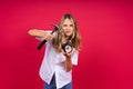 Kid girl holding hammer and alarm clock smiling with a happy and cool smile on face. showing teeth. Royalty Free Stock Photo