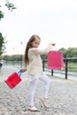 Kid girl with long hair fond of shopping. Fashionista girl shopping with pink bags. Shopping concept. Girl likes to buy Royalty Free Stock Photo