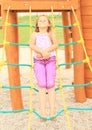 Kid - girl lying on net ladder