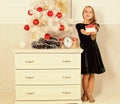 Kid girl near christmas tree hold gift box. Time to open christmas gifts. Merry christmas concept. Dreams come true