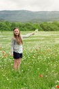 Kid girl picking flowers on the meadow Royalty Free Stock Photo