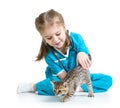 Kid girl playing doctor with kitten Royalty Free Stock Photo