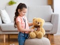 Kid Girl Playing Doctor Using Stethoscope Treating Teddy Bear Indoor Royalty Free Stock Photo