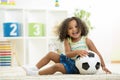 Kid girl playing toys at kindergarten room Royalty Free Stock Photo