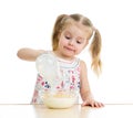 Child girl preparing corn flakes with milk Royalty Free Stock Photo