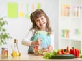 Kid girl preparing healthy food Royalty Free Stock Photo